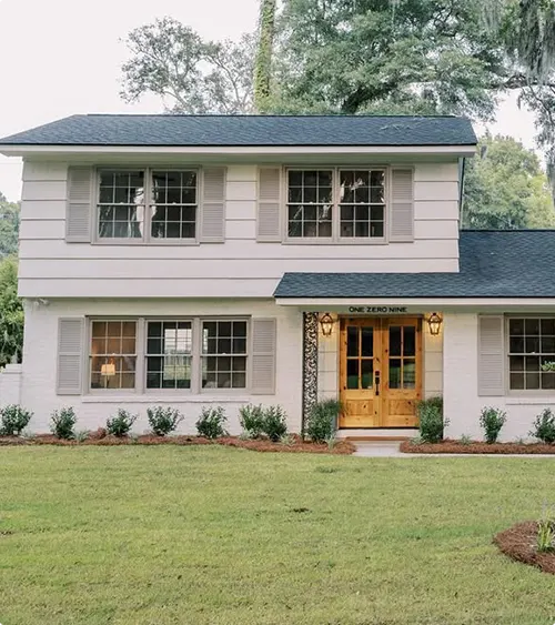 Natural wood double doors with multiple glass panes
