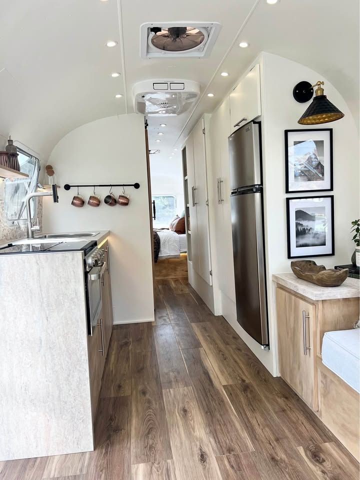 Leather strap cabinet handles in rustic Airstream