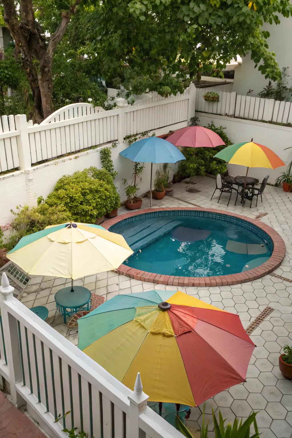 Stylish umbrellas offering shade and color around a small pool.