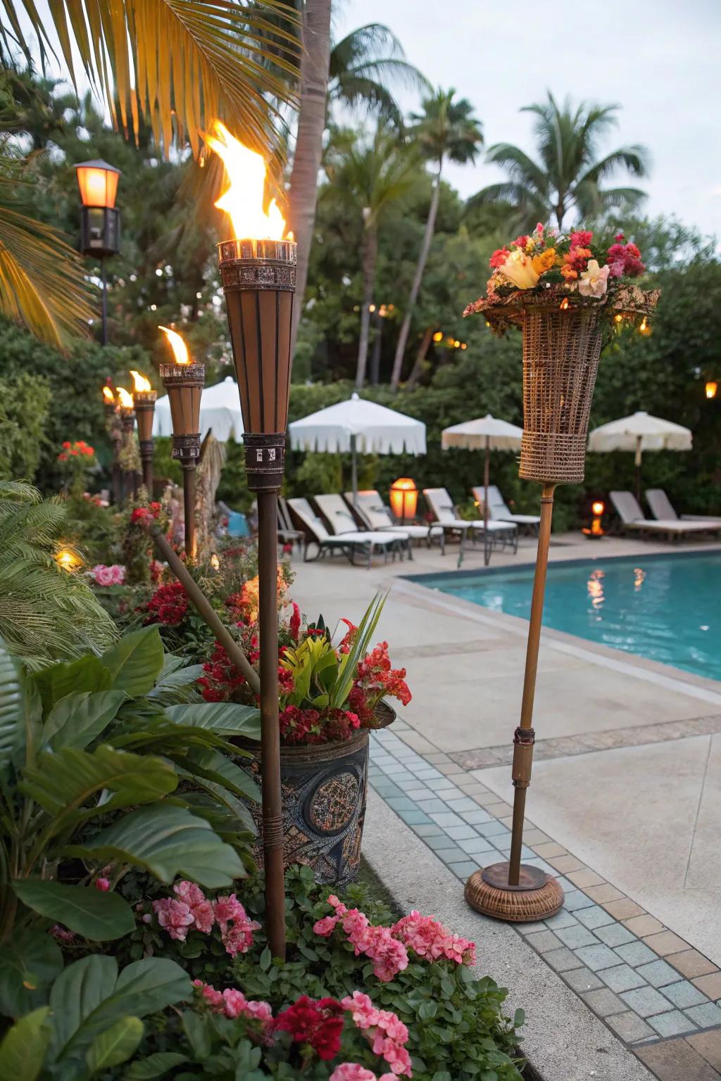 Tropical-themed poolside setup with tiki torches and decor.