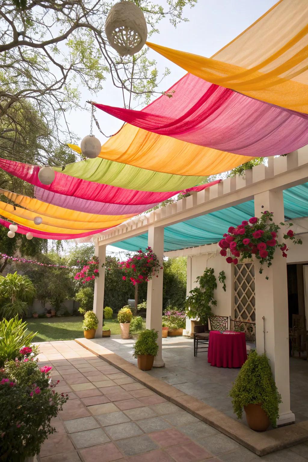 Layered shade cloths create a playful and colorful canopy.
