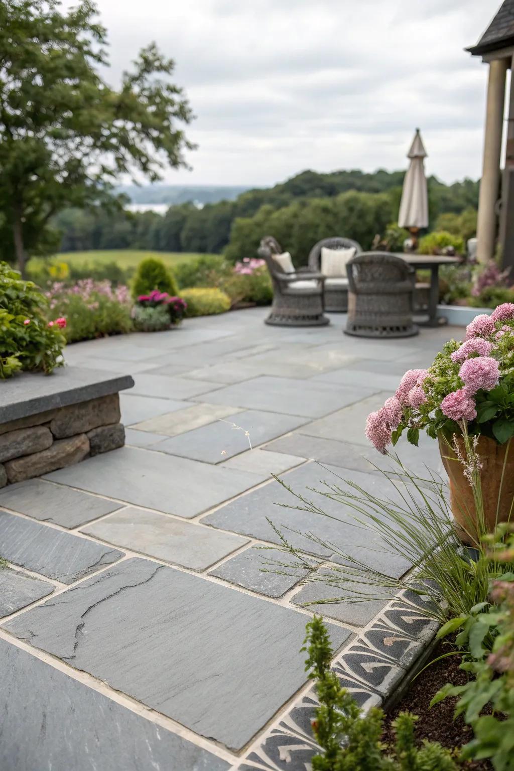 Natural stone features enhance the elegance of the grey patio.