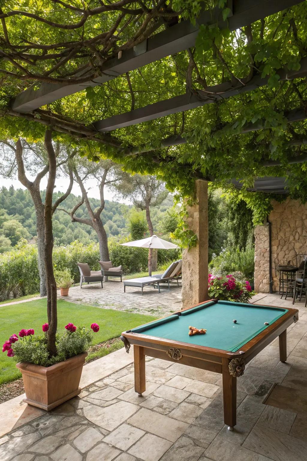 Patio pool table setup surrounded by natural greenery.