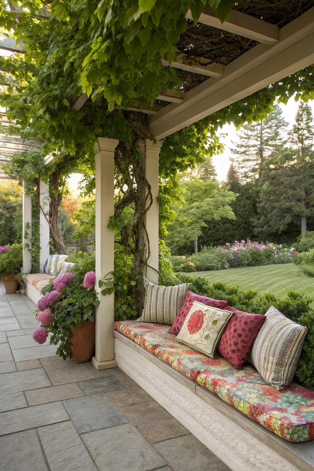 Cushioned bench seating under a cozy pergola.