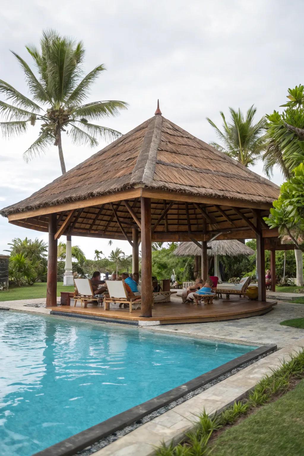 A poolside pavilion creates a chic and functional retreat.