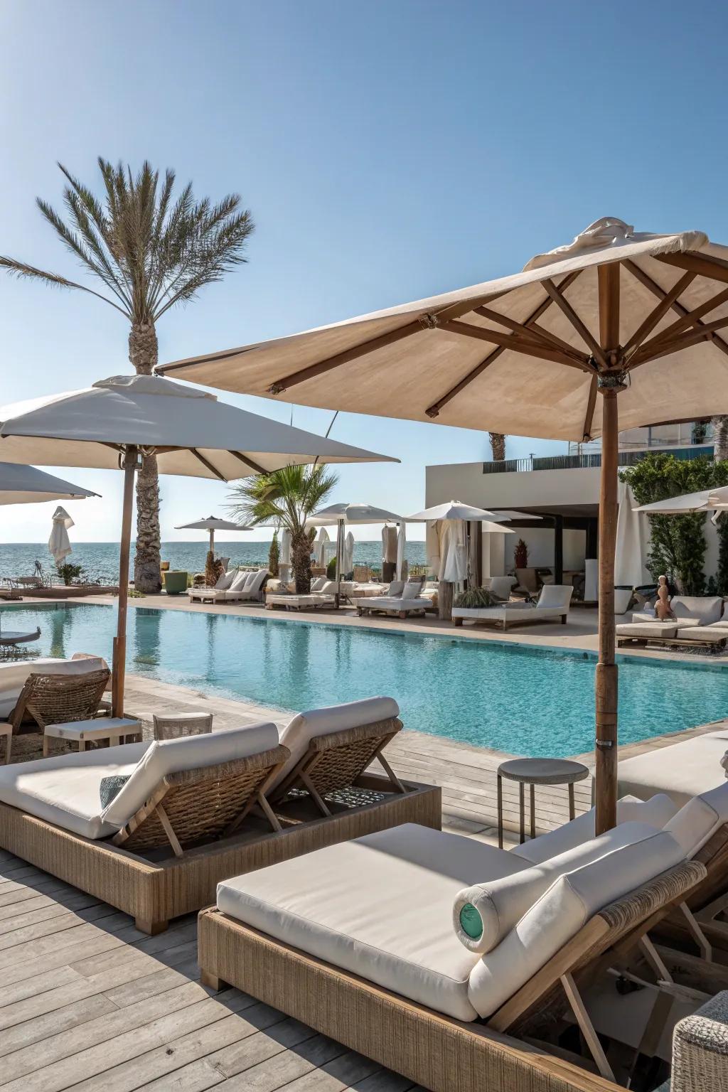 Elegant lounging space enhanced by matching pool umbrellas.