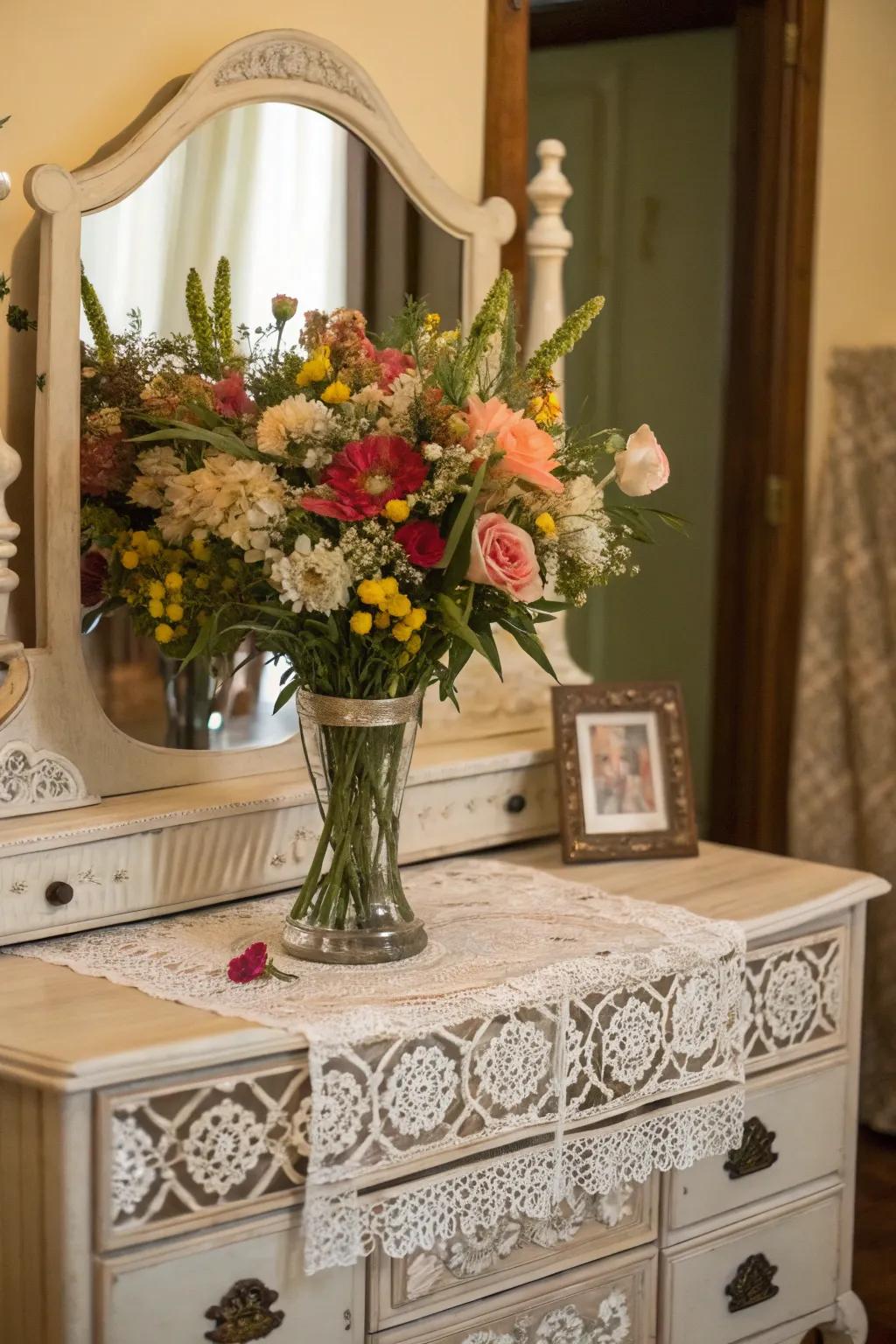 Fresh blossoms enliven the vintage vanity atmosphere.