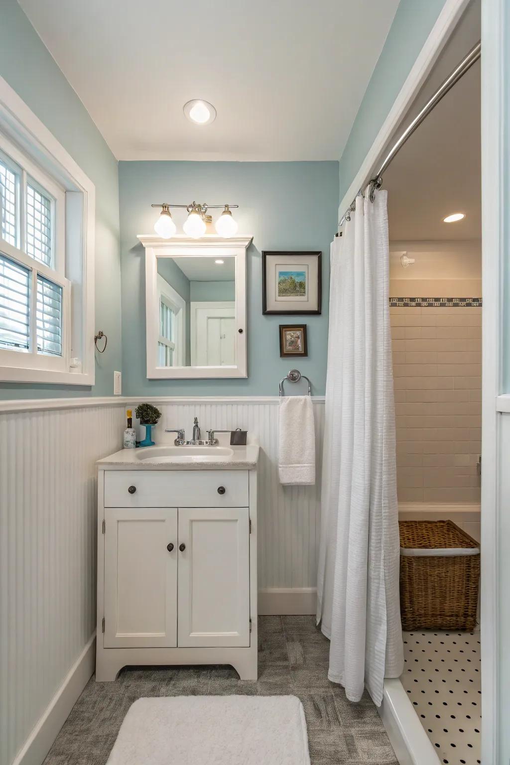 Soft blue bathroom with white accents