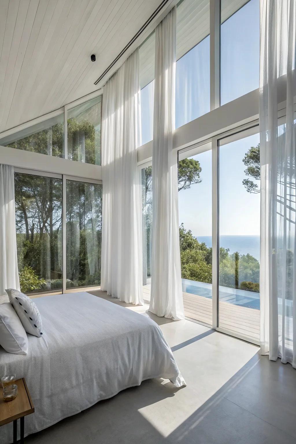 Expansive windows brighten the bedroom naturally.