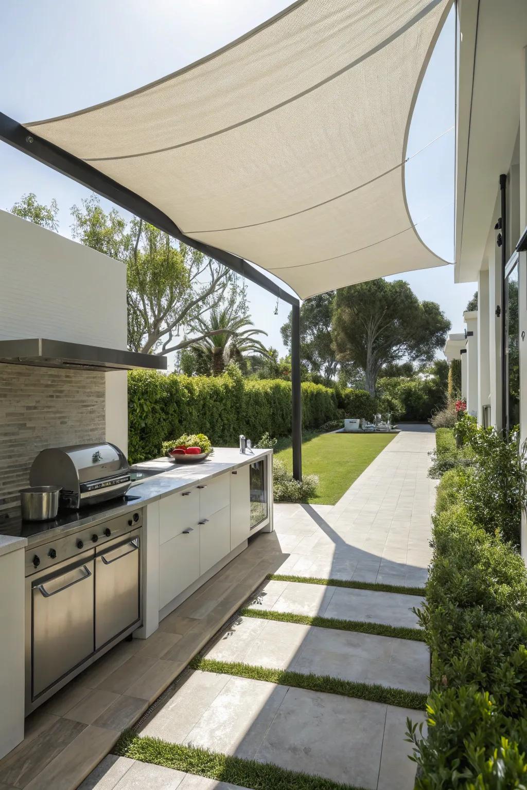 A sail shade provides a sleek and contemporary cover for your outdoor kitchen.