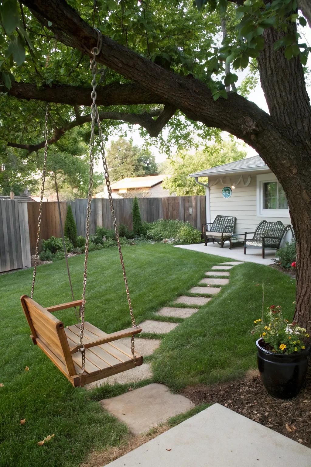 Children playing on a wooden swing in the backyard.