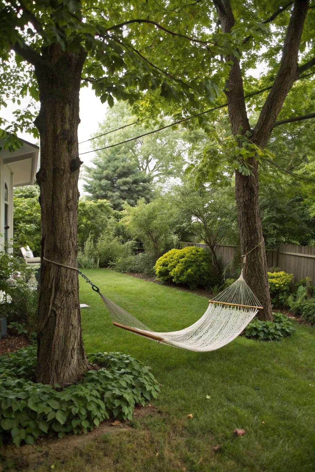 Comfortable hammock nestled in backyard trees.